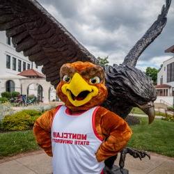 Rocky in front of the Red Hawk statue.